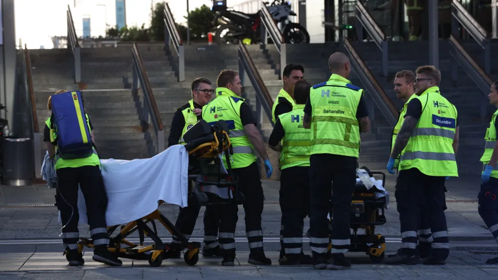 Emergency services at the Field's shopping center after a shooting, in Copenhagen, Denmark, Sunday, July 3, 2022. Danish police say several people have been shot at a Copenhagen shopping mall. Copenhagen police said that one person has been arrested in connection with the shooting at the Field's shopping mall on Sunday. Police tweeted that "several people have been hit" but gave no other details. (Olafur Steinar Gestsson/Ritzau Scanpix via AP)