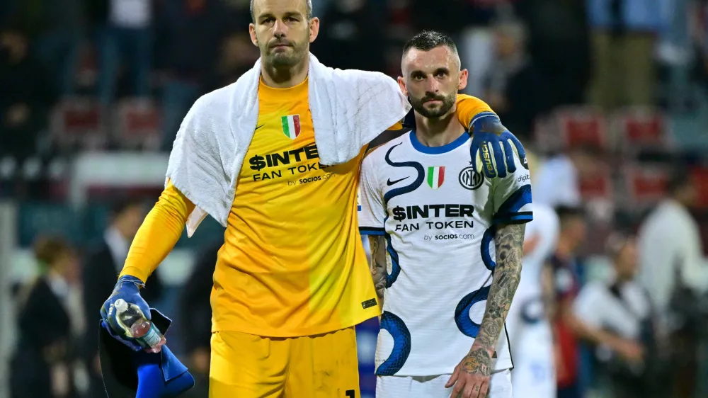 Soccer Football - Serie A - Cagliari v Inter Milan - Sardegna Arena, Cagliari, Italy - May 15, 2022 Inter Milan's Samir Handanovic with Marcelo Brozovic after the match REUTERS/Alberto Lingria