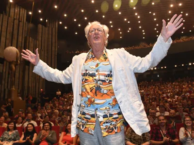 Australian actor Geoffrey Rush gestures on a stage in front of the audience&nbsp;prior to a screening of The King's Speech movie at the 56th Karlovy Vary International Film Festival in Karlovy Vary, Czech Republic, Wednesday, July 6, 2022. (Slavomir Kubes/CTK via AP)