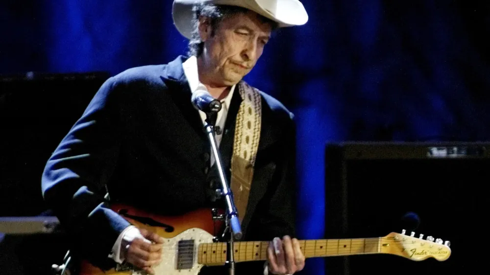 Rock musician Bob Dylan performs at the Wiltern Theatre in Los Angeles, in this May 5, 2004 file photo. Dylan was among a group of nominees which was announced on August 4, 2005 for a new American literary award pitched as a populist event with a touch of Hollywood glitz. Readers will vote for the winners in 19 categories that include graphic novels and romance, as well as the more traditional fiction and biography categories from established prizes such as the Pulitzer and the National Book Award. REUTERS/Robert Galbraith/Files