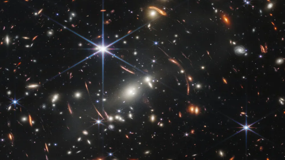 HANDOUT - 12 July 2022, ---, -: An image provided by NASA on 12 July 2022 shows the galaxy cluster SMACS 0723, captured by James Webb Space Telescope. The first image from NASA's new space telescope shows the deepest and sharpest image of the distant universe to date. The image known as Webb's First Deep Field shows galaxy cluster SMACS 0723 and is overflowing with detail. Photo: Space Telescope Science Institut/NASA/ESA/CSA/dpa - ATTENTION: editorial use only and only if the credit mentioned above is referenced in full