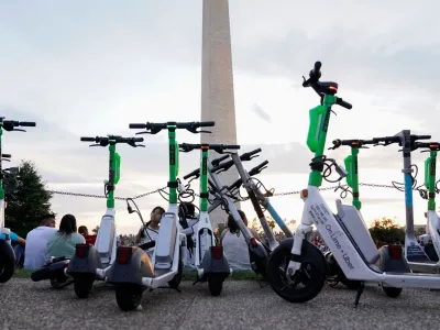 Electric scooters are parked during the annual Independence Day fireworks celebration on the National Mall in Washington, U.S July 4, 2022. REUTERS/Joshua Roberts