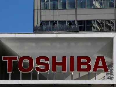 FILE PHOTO: The logo of Toshiba Corp is seen as window cleaners work on the company's headquarters in Tokyo, Japan, February 14, 2017. REUTERS/Toru Hanai/File Photo