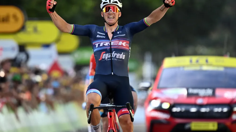 15 July 2022, France, Saint-Etienne: Danish cyclist Mads Pedersen of Trek-Segafredo celebrates winning the 13th stage of the 109th edition of the Tour de France cycling race, a 193-kilometer-long flat stage from Le Bourg-d'Oisans to Saint-Etienne. Photo: David Stockman/BELGA/dpa