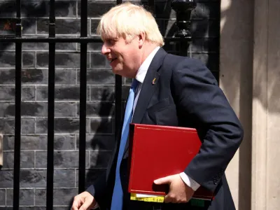 British Prime Minister Boris Johnson walks outside Downing Street in London, Britain, July 20, 2022. REUTERS/Henry Nicholls
