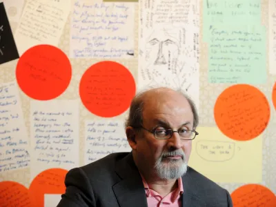FILED - 25 February 2010, US, Atlanta: Writer Salman Rushdie poses for a picture with some of his enlarged notes at an Emory University exhibit of his work in Atlanta. Rushdie was rushed to hospital for surgery after being attacked during a literary event in New York state on Friday. Photo: Erik Lesser/ZUMApress/dpa