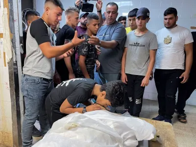 SENSITIVE MATERIAL. THIS IMAGE MAY OFFEND OR DISTURB People react next to the body of Palestinian Waseem Khalifa, 18, who was killed by Israeli forces during clashes in a raid, in Nablus in the Israeli-occupied West Bank, August 18, 2022. REUTERS/Adel Abu Nemeh NO RESALES. NO ARCHIVES