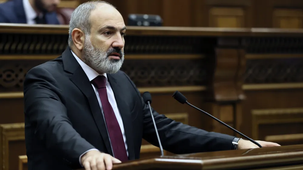 Armenian Prime minister Nikol Pashinyan delivers his speech at the National Assembly of Armenia in Yerevan, Armenia, Tuesday, Sept. 13, 2022. Armenia's prime minister says that 49 soldiers have been killed in nighttime attacks by Azerbaijan. (Tigran Mehrabyan/PAN Photo via AP)