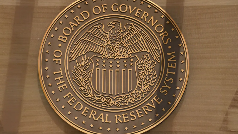 A sign for the Federal Reserve Board of Governors is seen at the entrance to the William McChesney Martin Jr. building ahead of a news conference by Federal Reserve Board Chairman Jerome Powell on interest rate policy, in Washington, U.S., September 21, 2022. REUTERS/Kevin Lamarque