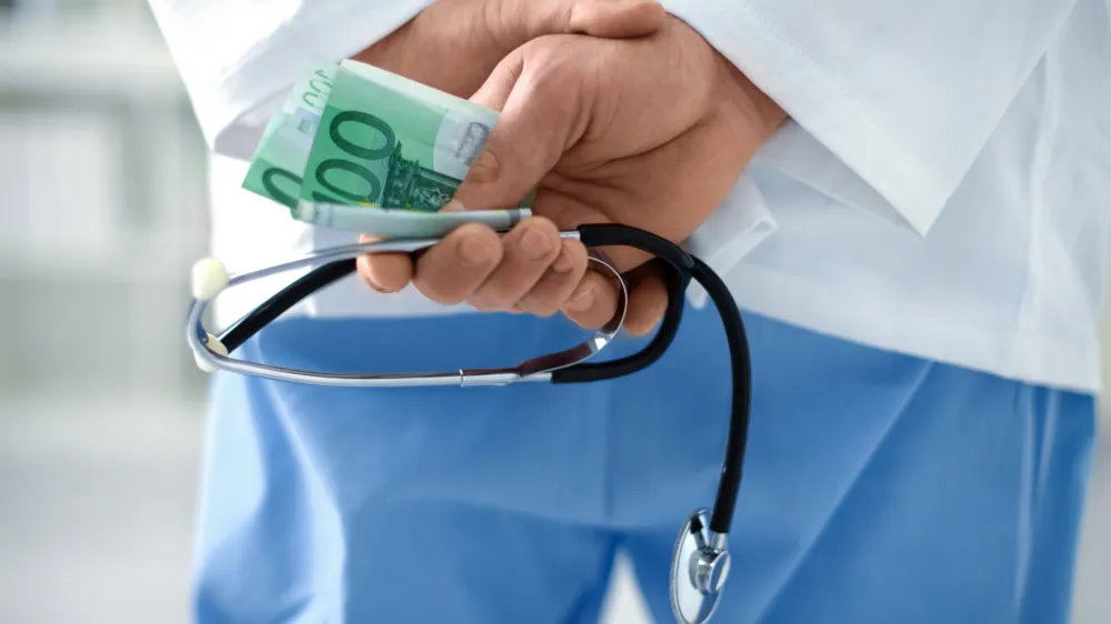 Corrupt doctor in hospital with stethoscope