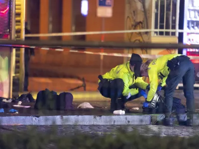 02 October 2022, Slovakia, Bratislava: Police officers intervene at the scene, where a car crashed into a public transport stop on Zochova Street in Bratislava. The accident resulted in four dead and seven injured. Photo: Martin Baumann/TASR/dpa