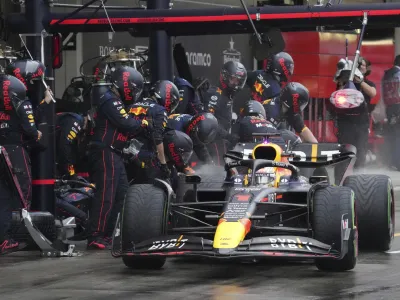 Red Bull driver Max Verstappen of the Netherlands powers his car out of the pits during the Japanese Formula One Grand Prix at the Suzuka Circuit in Suzuka, central Japan, Sunday, Oct. 9, 2022. (AP Photo/Toru Hanai, Pool)