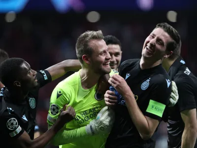 Soccer Football - Champions League - Group B - Atletico Madrid v Club Brugge - Metropolitano, Madrid, Spain - October 12, 2022 Club Brugge's Simon Mignolet, Clinton Mata and Hans Vanaken celebrate after the match REUTERS/Violeta Santos Moura