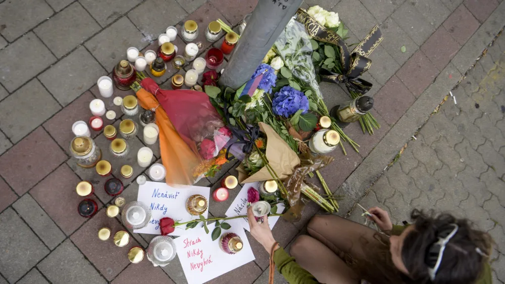 13 October 2022, Slovakia, Bratislava: People put down candles at the scene of a shooting outside a gay bar. A man in Bratislava killed two men and seriously injured a waitress near a popular gay pub in the city centre on Wednesday evening. Photo: Pavol Zachar/TASR/dpa