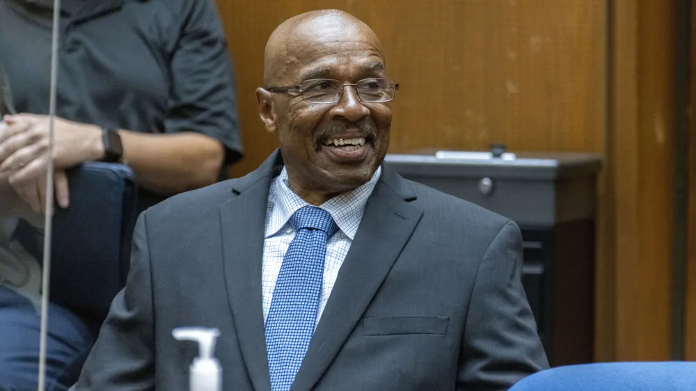 In this photo provided by Cal State LA, Maurice Hastings smiles at a hearing at Los Angeles Superior Court where a judge dismissed his conviction for murder after new DNA evidence exonerated him, Oct. 20, 2022, in Los Angeles. (J. Emilio Flores/Cal State LA via AP)