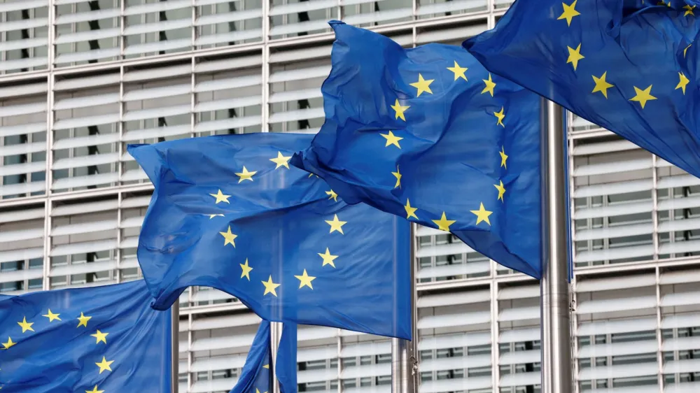 FILE PHOTO: European Union flags flutter outside the EU Commission headquarters in Brussels, Belgium, September 28, 2022. REUTERS/Yves Herman/File Photo