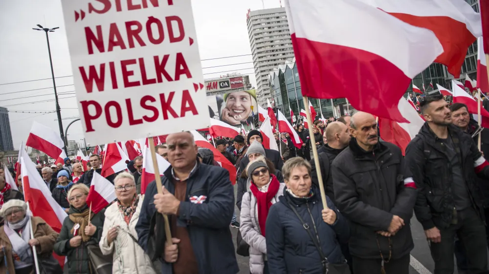 11 November 2022, Poland, Warsaw: Participants hold placards and wave Polish flags during the Independence March. Photo: Attila Husejnow/SOPA Images via ZUMA Press Wire/dpa