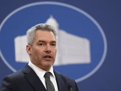 Austria's Chancellor Karl Nehammer speaks during a press conference after official talks with Serbian Prime Minister Ana Brnabic at the Serbia Palace in Belgrade, Serbia, Thursday, March 17, 2022. Nehammer is on a one-day official visit to Serbia. (AP Photo/Darko Vojinovic)