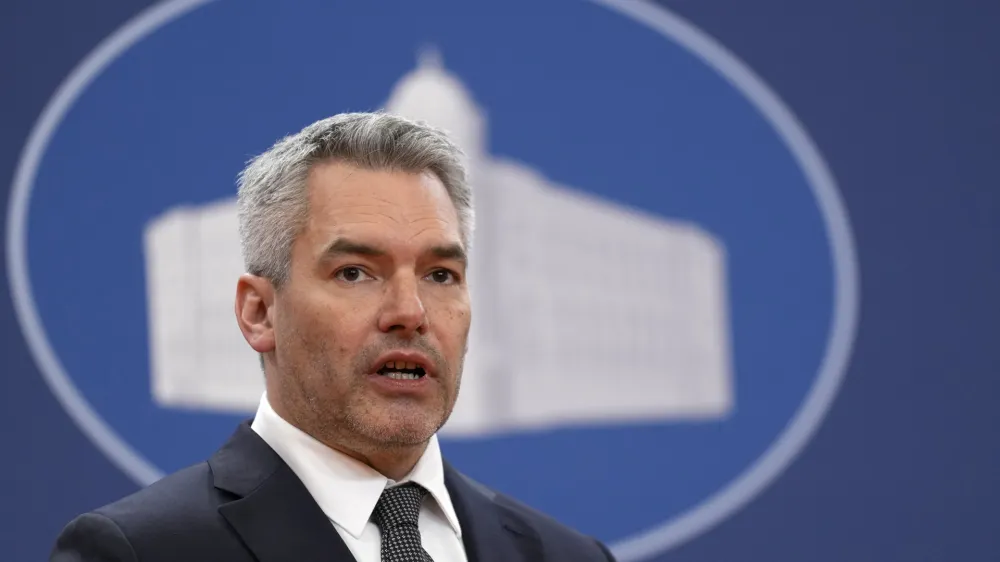 Austria's Chancellor Karl Nehammer speaks during a press conference after official talks with Serbian Prime Minister Ana Brnabic at the Serbia Palace in Belgrade, Serbia, Thursday, March 17, 2022. Nehammer is on a one-day official visit to Serbia. (AP Photo/Darko Vojinovic)