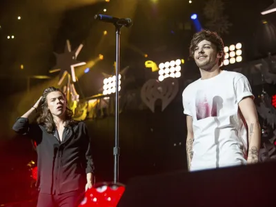 Harry Styles and Louis Tomlinson of One Direction perform during 106.1 KISS FM's iHeartRadio Jingle Ball at American Airlines Center on Dec. 1, 2015, in Dallas. (Photo by Amy Harris/Invision/AP)