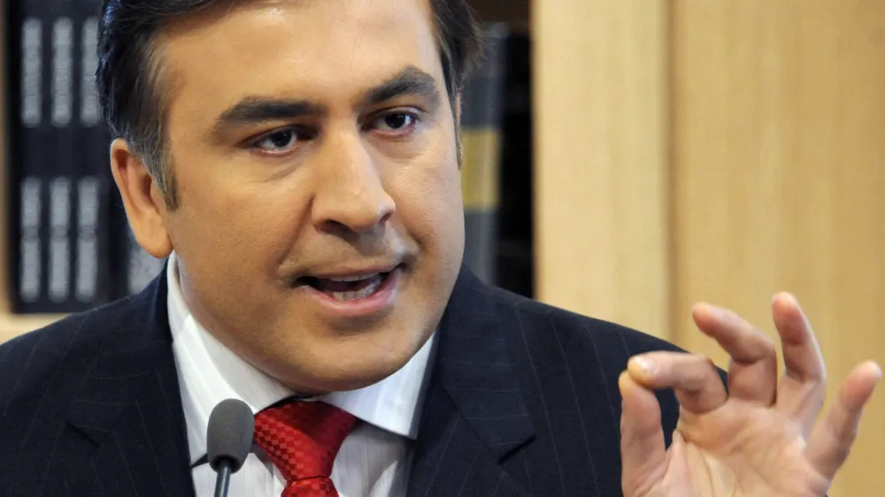 Georgian President Mikhail Saakashvili gestures as he meets with businessmen, in Tbilisi, Georgia, Friday, April 10, 2009. Several hundred demonstrators blocked the street in front of Georgia's parliament Friday as protests demanding the president's resignation entered their second day. (AP Photo/Irakli Gedenidze, Pool)