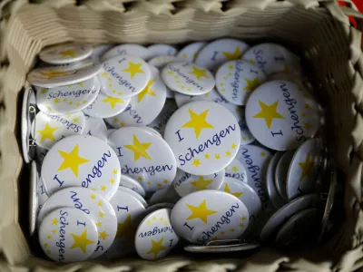 FILE PHOTO: Badges with text 'I Love Schengen' are pictured at a store of the European museum of Schengen, Luxembourg January 27, 2016. REUTERS/Wolfgang Rattay/File Photo