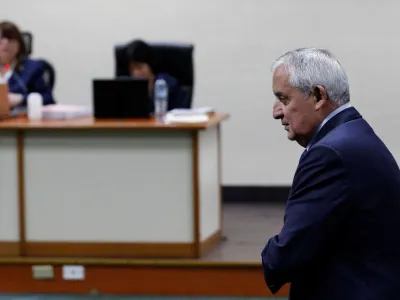 Former Guatemalan President Otto Perez Molina walks in front of the judges after being found guilty of a corruption case during his administration, at the judicial building, in Guatemala City, Guatemala December 7, 2022. REUTERS/Luis Echeverria