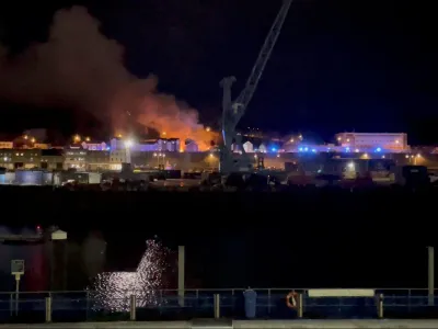 A general view of fire and smoke in Saint Helier following an explosion on the island of Jersey, Channel Islands December 10, 2022 in this still image obtained from a social media video. Daniel Hunt/via REUTERS THIS IMAGE HAS BEEN SUPPLIED BY A THIRD PARTY. MANDATORY CREDIT. NO RESALES. NO ARCHIVES.
