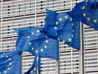 FILE PHOTO: European Union flags flutter outside the EU Commission headquarters in Brussels, Belgium, September 28, 2022. REUTERS/Yves Herman//File Photo/File Photo