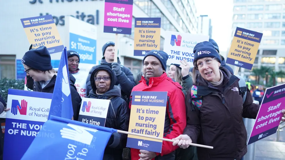 15 December 2022, United Kingdom, London: RCN General Secretary Pat Cullen with members of the Royal College of Nursing (RCN) take part in a protest outside St Thomas' Hospital in London as nurses in England, Wales and Northern Ireland take industrial action over pay. Photo: Stefan Rousseau/PA Wire/dpa