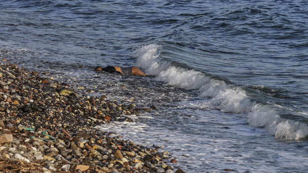 EDS NOTE: GRAPHIC CONTENT - The body of an unidentified man is seen washed up on a beach on the Greek island of Lesbos. on Tuesday, March 1, 2022. Greece&acirc;&euro;&trade;s coast guard says six bodies have been recovered from the shore of the eastern island of Lesbos, and authorities suspect the people were migrants who died in their attempt to make it to Greece from the nearby Turkish coast. (AP Photo/Panagiotis Balaskas)
