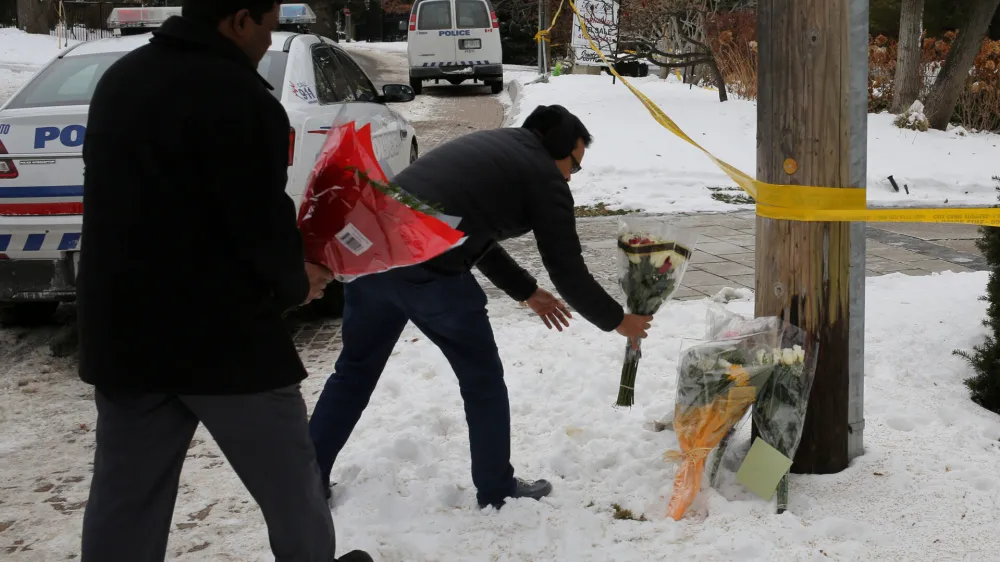 ﻿FILE PHOTO: Mourners place flowers outside the home of billionaire founder of Canadian pharmaceutical firm Apotex Inc., Barry Sherman and his wife Honey, who were found dead under circumstances that police described as "suspicious", in Toronto, Ontario, Canada, December 17, 2017. REUTERS/Chris Helgren/File Photo