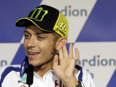 Yamaha MotoGP rider Valentino Rossi of Italy gestures during a news conference before the Czech Grand Prix in Brno August 12, 2010.  REUTERS/David W Cerny (CZECH REPUBLIC - Tags: SPORT MOTOR RACING)