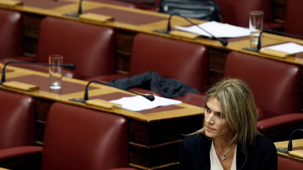 FILE PHOTO: Lawmaker Eva Kaili is seen in the parliament in Athens November 4, 2011, prior to a confidence vote. Kaili had announced she would stay in the party but refused to support the government in the confidence vote expected late on Friday, meaning Prime Minister George Papandreou could count at most on the support of 151 deputies. REUTERS/Yiorgos Karahalis (GREECE - Tags: POLITICS BUSINESS)/File Photo