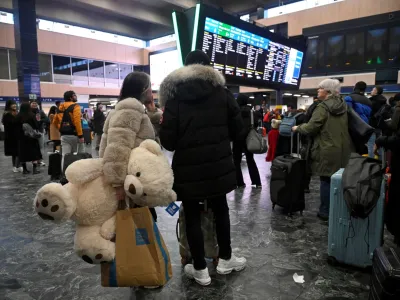 People wait at Euston station ahead of a rail workers' strike over pay and terms, on Christmas Eve in London, Britain December 24, 2022. REUTERS/Toby Melville
