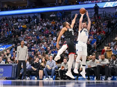 Dec 29, 2022; Dallas, Texas, USA; Dallas Mavericks guard Luka Doncic (77) shoots over Houston Rockets guard Eric Gordon (10) during the second half at the American Airlines Center. Mandatory Credit: Jerome Miron-USA TODAY Sports