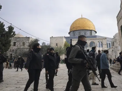 Israeli police escort Jewish visitors to the Al-Aqsa Mosque compound, known to Muslims as the Noble Sanctuary and to Jews as the Temple Mount, in the Old City of Jerusalem, Tuesday, Jan. 3, 2023. Itamar Ben-Gvir, an ultranationalist Israeli Cabinet minister, visited the flashpoint Jerusalem holy site Tuesday for the first time since taking office in Prime Minister Benjamin Netanyahu's new far-right government last week. The visit is seen by Palestinians as a provocation. (AP Photo/Maya Alleruzzo)