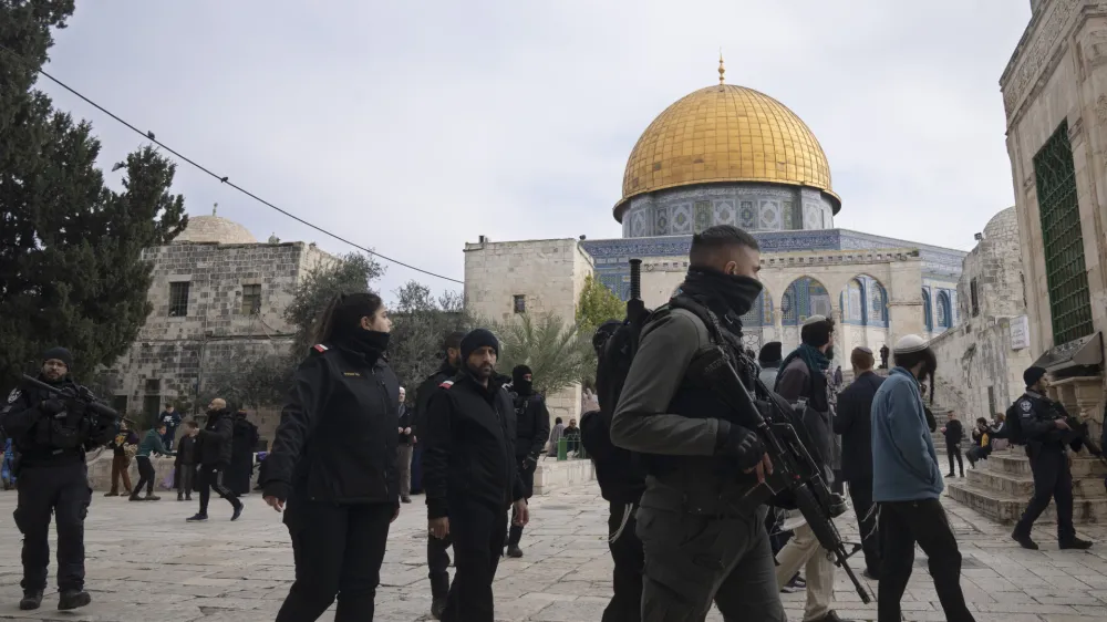 Israeli police escort Jewish visitors to the Al-Aqsa Mosque compound, known to Muslims as the Noble Sanctuary and to Jews as the Temple Mount, in the Old City of Jerusalem, Tuesday, Jan. 3, 2023. Itamar Ben-Gvir, an ultranationalist Israeli Cabinet minister, visited the flashpoint Jerusalem holy site Tuesday for the first time since taking office in Prime Minister Benjamin Netanyahu's new far-right government last week. The visit is seen by Palestinians as a provocation. (AP Photo/Maya Alleruzzo)