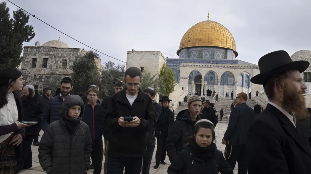 Jewish worshippers visit the Temple Mount at Al-Aqsa Mosque compound, known to Muslims as the Noble Sanctuary, in the Old City of Jerusalem, Tuesday, Jan. 3, 2023. Itamar Ben-Gvir, an ultranationalist Israeli Cabinet minister, visited the flashpoint Jerusalem holy site Tuesday for the first time since taking office in Prime Minister Benjamin Netanyahu's new far-right government last week. The visit is seen by Palestinians as a provocation. (AP Photo/Maya Alleruzzo)