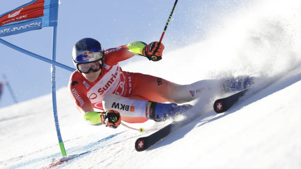 Switzerland's Marco Odermatt speeds down the course during an alpine ski, men's World Cup giant slalom race, in Adelboden, Switzerland, Saturday, Jan. 7, 2023. (AP Photo/Giovanni Pizzato)