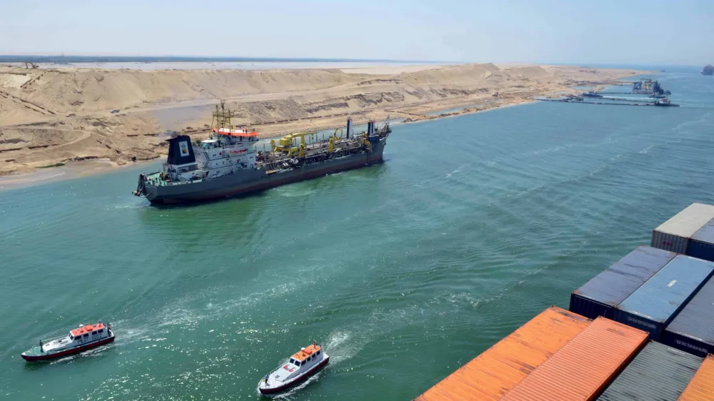 ﻿A cargo ship is seen crossing through the New Suez Canal, Ismailia, Egypt, in this July 25, 2015 file photo. Egypt will open an expansion to the Suez Canal to great fanfare on August 6, 2015, the centrepiece of President Abdel Fattah al-Sisi's plans to revitalise the country's economy. To match EGYPT-SUEZCANAL/ REUTERS/Stringer/Files