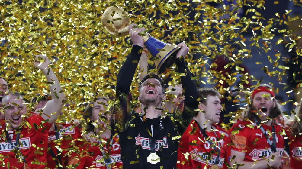 ﻿Handball - 2021 IHF Handball World Championship - Gold Medal Match - Denmark v Sweden - Cairo Stadium Hall 1, Cairo, Egypt - January 31, 2021 Denmark's Niklas Landin Jacobsen lifts the trophy as they celebrate after winning the Gold Medal Match REUTERS/Mohamed Abd El Ghany