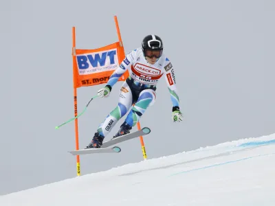 Slovenia's Ilka Stuhec speeds down the course during an alpine ski, women's World Cup downhill training, in St. Moritz, Switzerland, Thursday, Dec.15, 2022. (AP Photo/Giovanni Maria Pizzato)