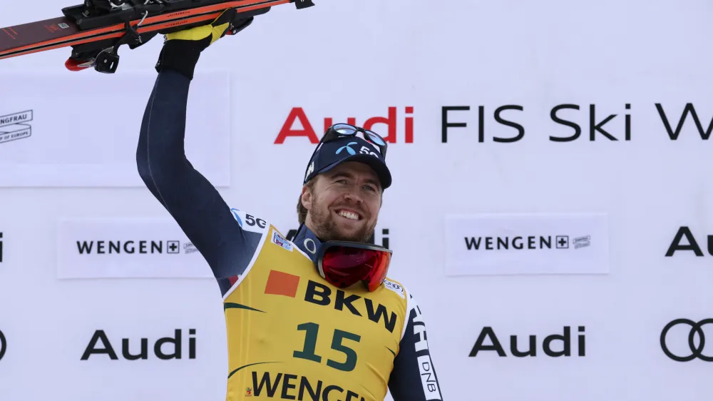 Norway's Aleksander Aamodt Kilde celebrates on the podium after winning an alpine ski, men's World Cup super G race, in Wengen, Switzerland, Friday, Jan. 13, 2023. (AP Photo/Alessandro Trovati)