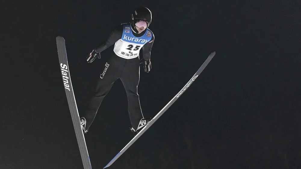 Canadian skier Alexandria Loutitt competes during the first jump of the women's World Cup ski jump event in Zao, Yamagata prefecture, northern Japan, on Jan. 13, 2023. (Yuya Shino/Kyodo News via AP)