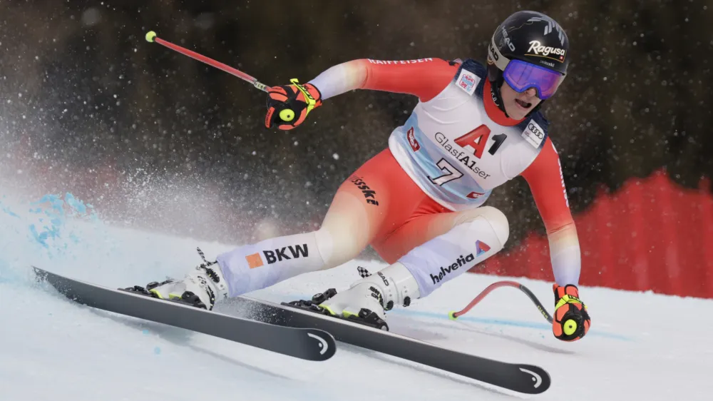 Switzerland's Lara Gut Behrami speeds down the course during an alpine ski, women's World Cup super-G, in St. Anton, Austria, Sunday, Jan.15, 2023. (AP Photo/Giovanni Maria Pizzato)