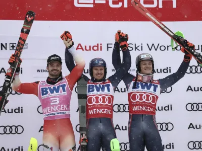 From left, second placed Switzerland's Loic Meillard, the winner Norway's Henrik Kristoffersen and third placed Norway's Lucas Braathen celebrate after completing an alpine ski, men's World Cup slalom, in Wengen, Switzerland, Sunday, Jan. 15, 2023. (AP Photo/Gabriele Facciotti)