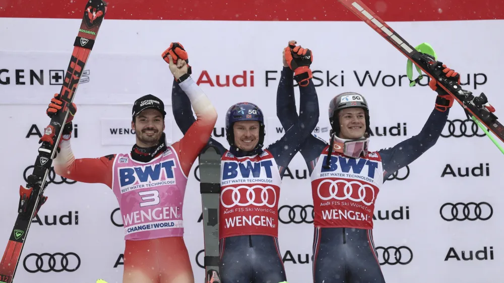 From left, second placed Switzerland's Loic Meillard, the winner Norway's Henrik Kristoffersen and third placed Norway's Lucas Braathen celebrate after completing an alpine ski, men's World Cup slalom, in Wengen, Switzerland, Sunday, Jan. 15, 2023. (AP Photo/Gabriele Facciotti)