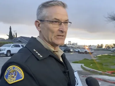 In this frame grab from video provided by the Tulare Count Sheriff's Office, Sheriff Mike Boudreaux speaks to the media near the scene of a fatal shooting in Visalia, Calif., Monday, Jan. 16, 2023. (Tulare County Sheriff's Office via AP)