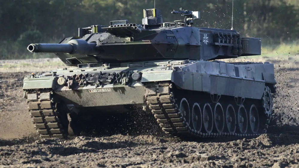 FILE - A Leopard 2 tank is pictured during a demonstration event held for the media by the German Bundeswehr in Munster near Hannover, Germany, Wednesday, Sept. 28, 2011. Germany faces mounting pressure to supply battle tanks to Kyiv and Ukrainian President Volodymyr Zelenskyy is airing frustration about not obtaining enough weaponry as Western allies confer on how best to support Ukraine nearly 11 months into Russia's invasion. Germany's new defense minister welcomed U.S. Defense Secretary Lloyd Austin to Berlin, declaring that German weapons systems delivered so far have proven their worth and that aid will continue in the future. (AP Photo/Michael Sohn, File)